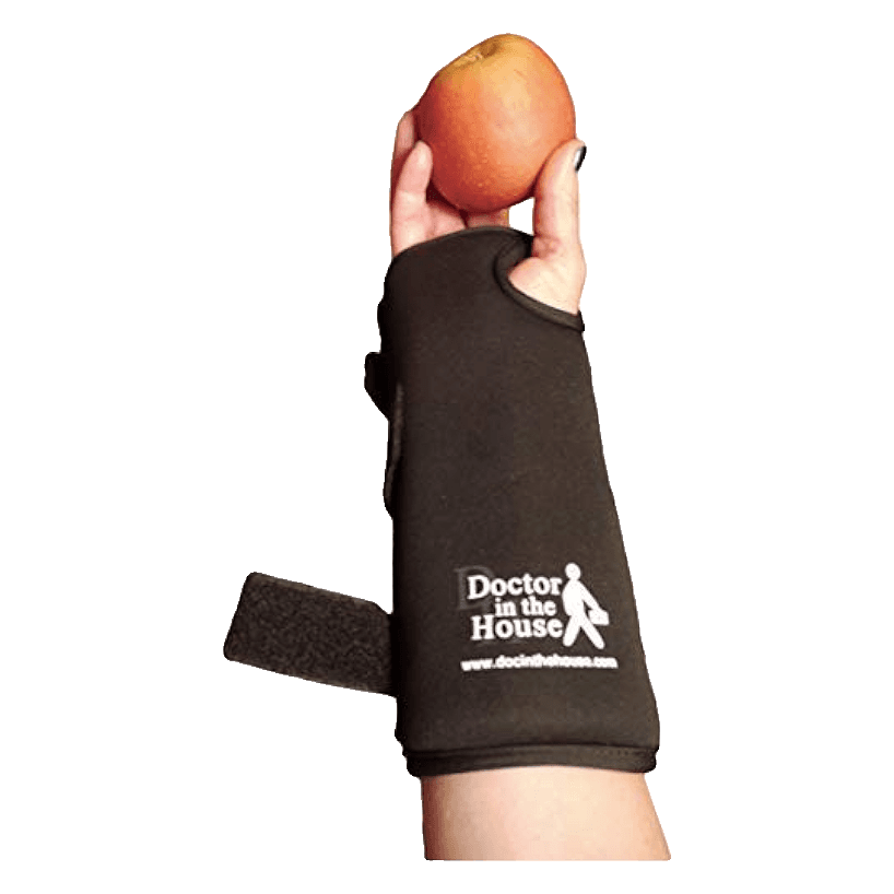 Miracle Splint Pro wrist brace worn on a right hand holding an apple