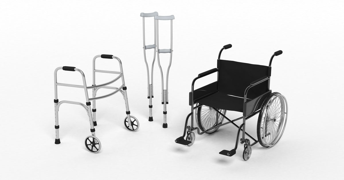 A white background with several medical devices. There is a walker, two crutches, and a black wheelchair.