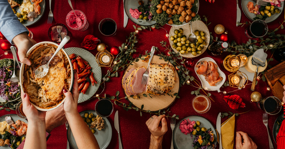 Table filled with various Thanksgiving food