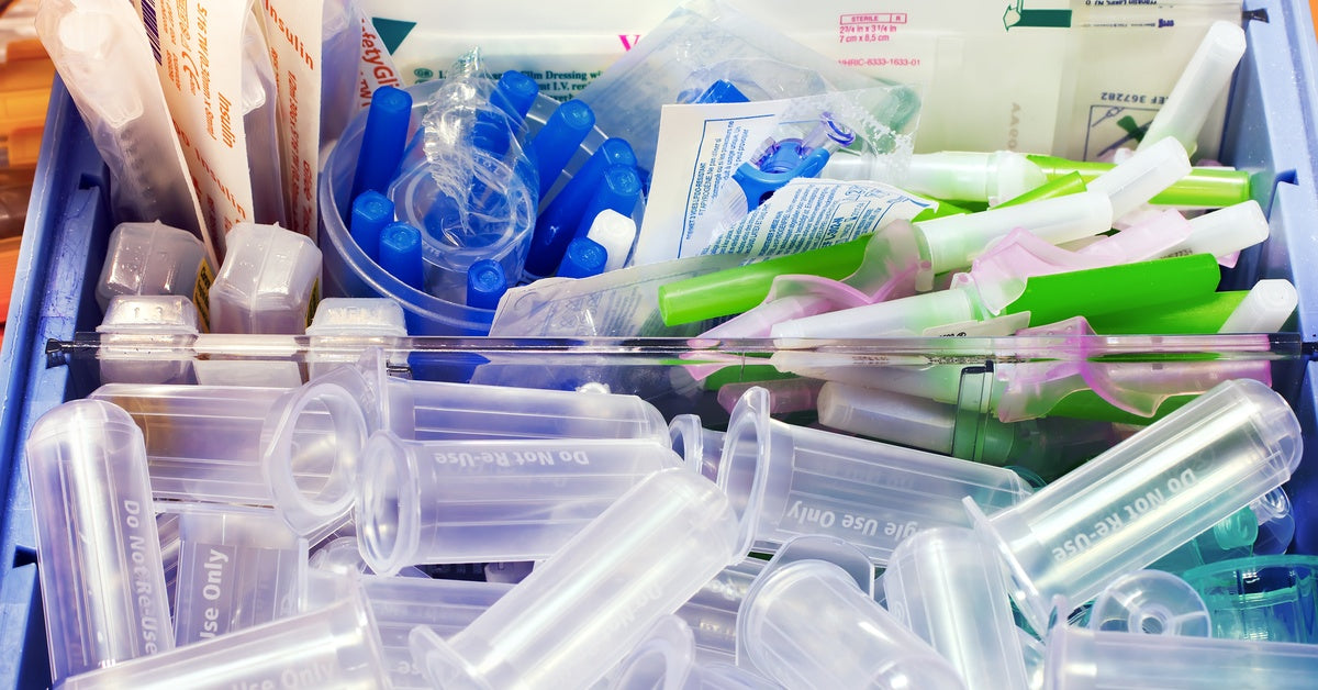 A drawer with various laboratory supplies crowded together and separated by dividers.